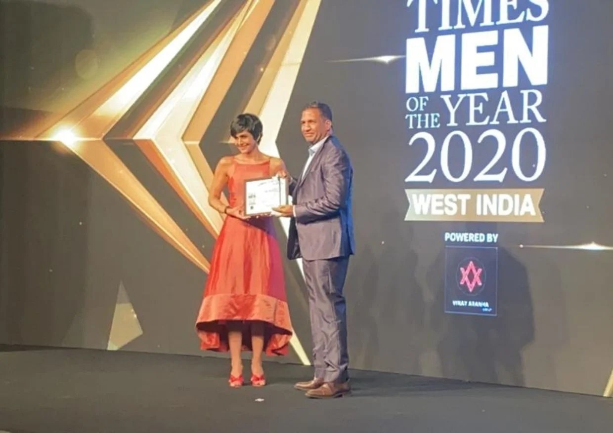 Award ceremony at Times Men of the Year 2020 West India, showing the award presentation